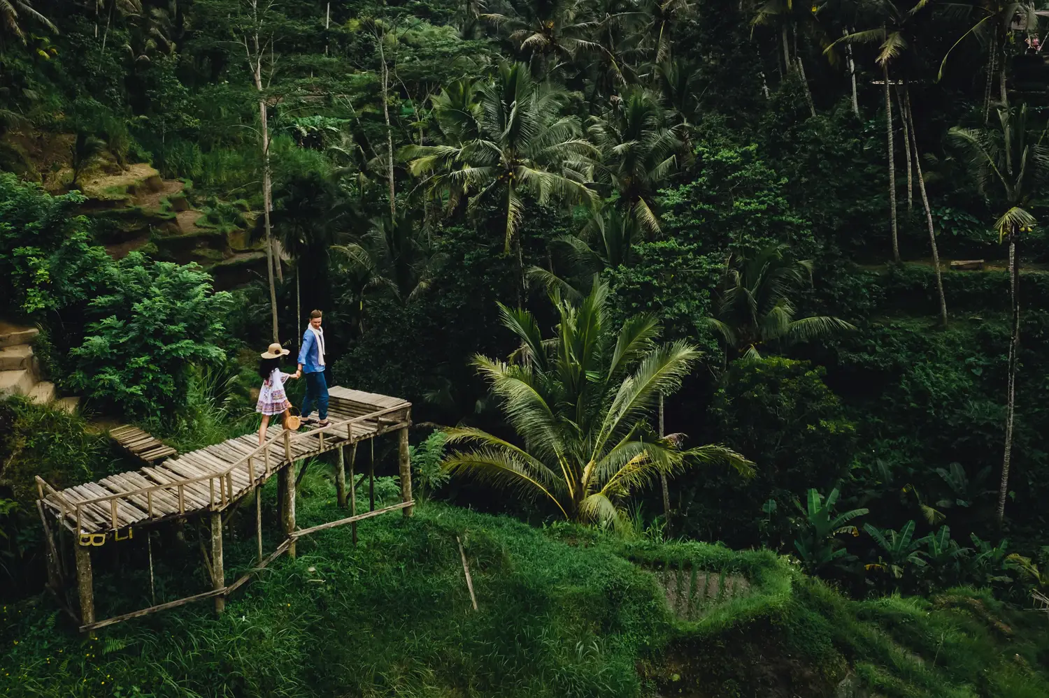 couple standing on wooden bridge near rice terrace 2023 11 27 05 30 31 utc fractional